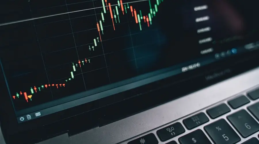 Close-up of a computer screen displaying cryptocurrency market trends and data.