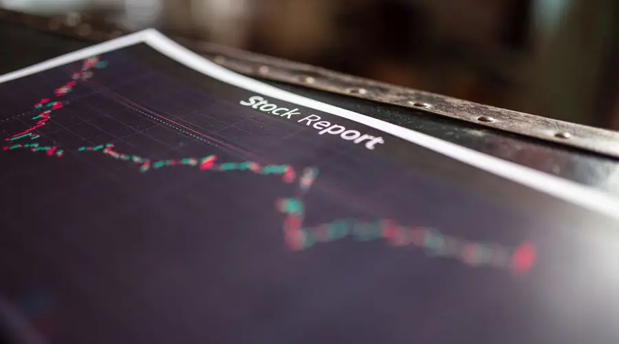 Detailed stock report showing market trends on paper charts.
