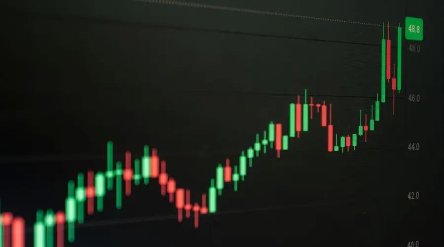 Close-up of a digital candlestick chart indicating bullish market trends in trading.