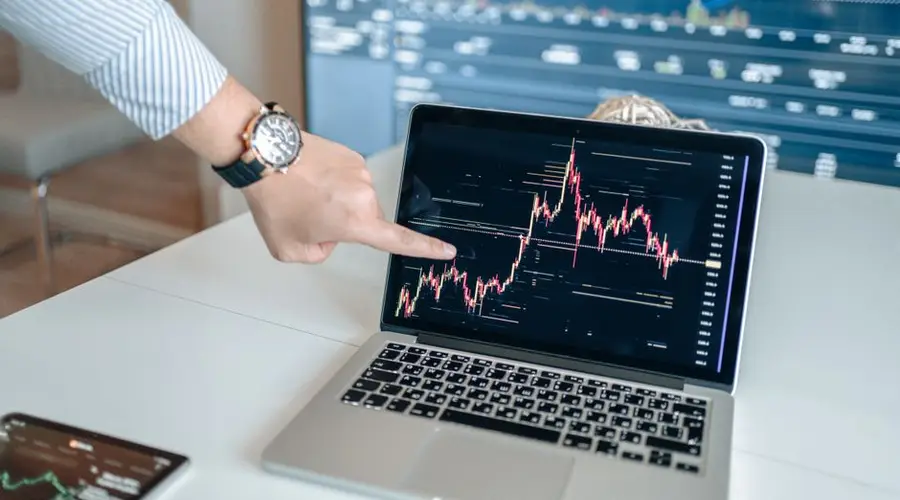Detailed financial trading screen with colorful charts and data representing market fluctuations.