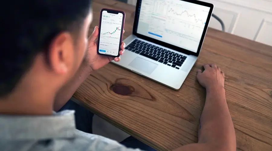 Detailed financial trading screen with colorful charts and data representing market fluctuations.