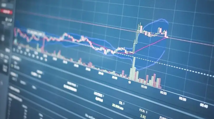 Close-up of a financial graph on a screen showing stock market trading data and trends.