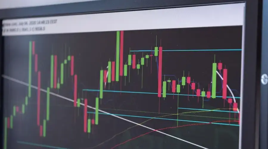 A close-up view of a cryptocurrency trading chart displayed on a monitor, showcasing market trends.