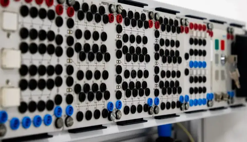 Detailed image of a modern industrial control panel featuring multiple connectors and buttons.