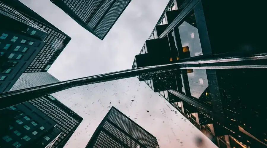 Dynamic low angle view of futuristic skyscrapers in a modern cityscape.