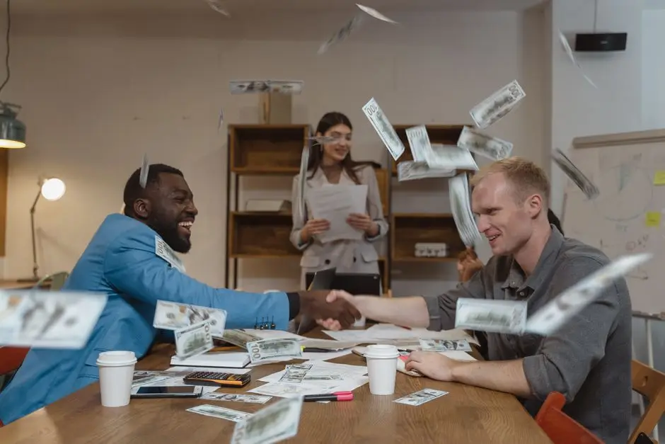 A lively office meeting with colleagues and money flying around, depicting success and finance.