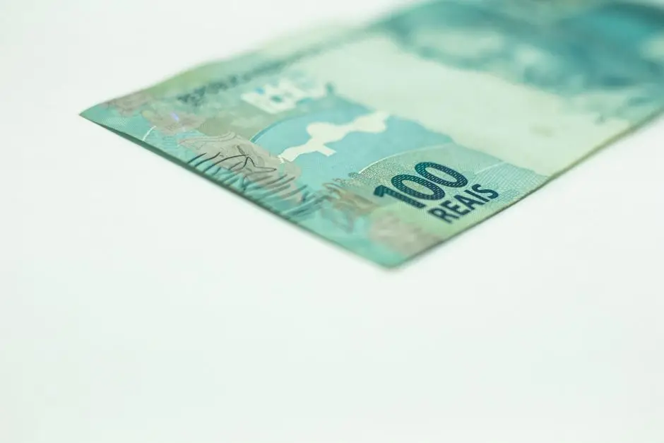 Macro shot of a Brazilian 100 Reais banknote isolated on a white background, featuring copy space.