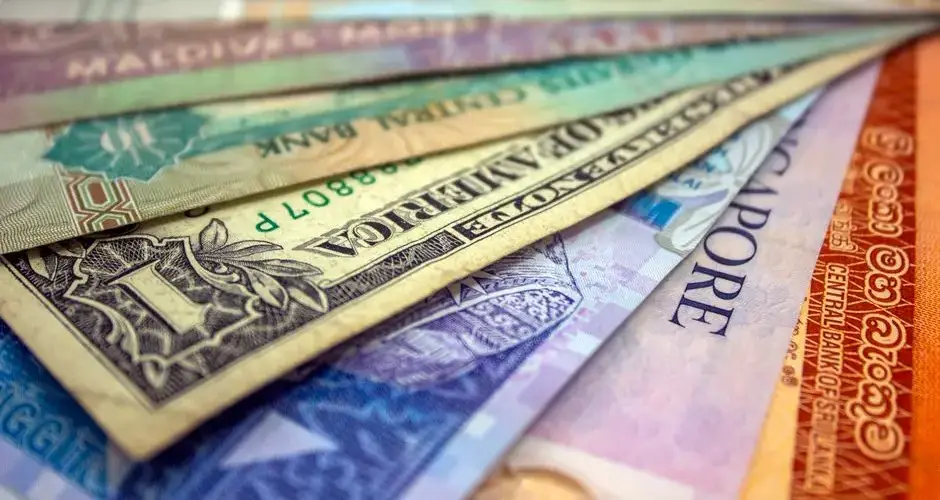A close-up view of various international banknotes showcasing diverse currencies.