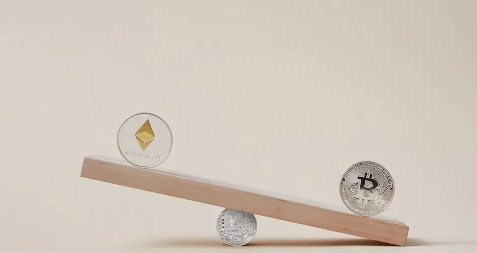 Minimalist image of Ethereum and Bitcoin coins balancing on a plank, symbolizing crypto market dynamics.