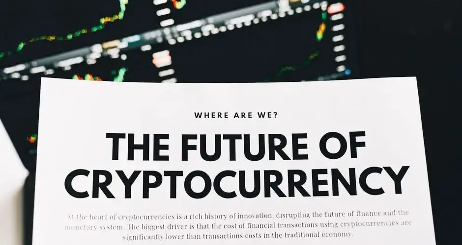 Close-up of a finance article on cryptocurrency with charts in the background.