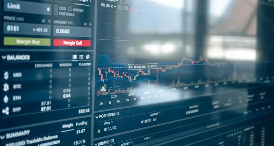 Close-up of a digital screen displaying stock trading graphs and cryptocurrency values. Ideal for finance and technology themes.