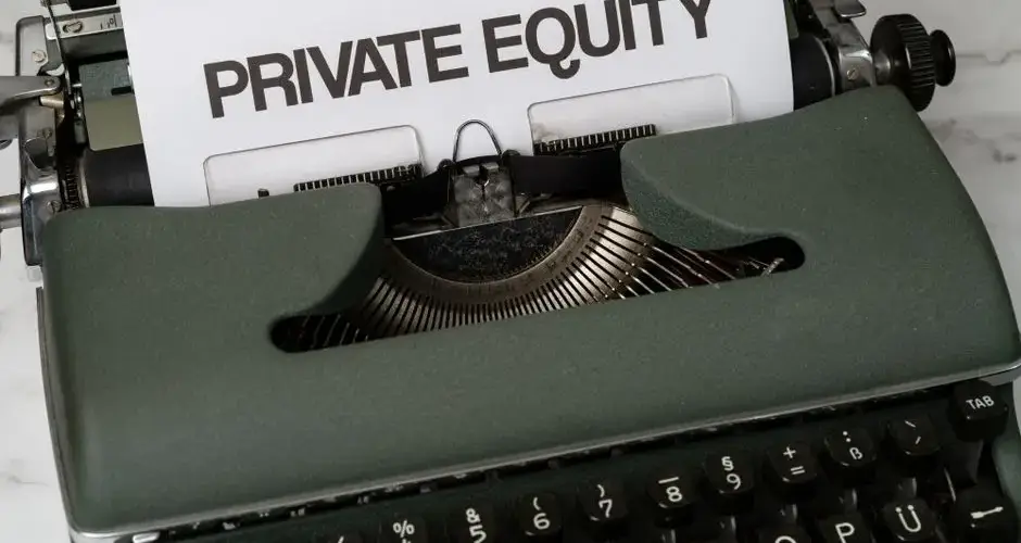 Close-up of vintage typewriter with 'PRIVATE EQUITY' on paper, business concept.