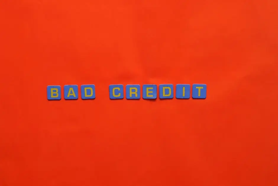 Blue letter blocks spelling 'Bad Credit' on an orange background.