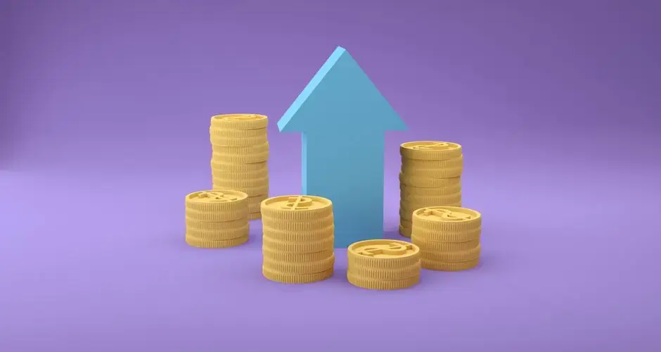 Stacks of coins with an upward arrow symbolizing financial growth and success.