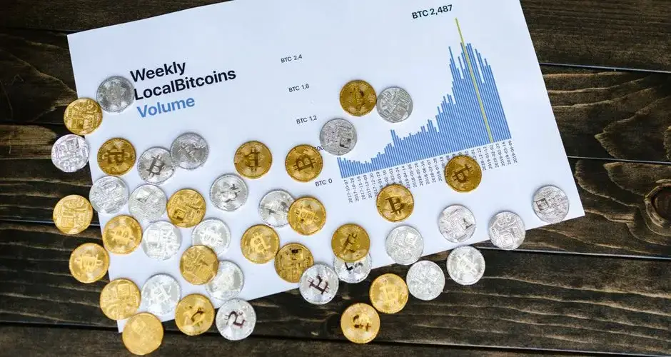 A visual representation of weekly bitcoin volume and data analysis with coins.
