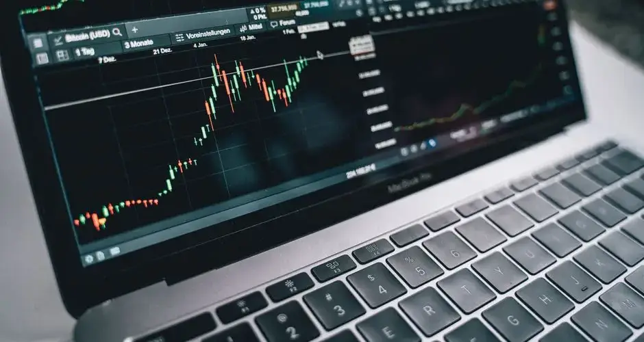 Close-up of a financial graph on a laptop screen, depicting stock market analysis in Berlin.