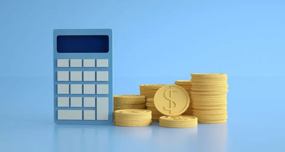 A conceptual image of a calculator with gold coins symbolizing finance and income growth.