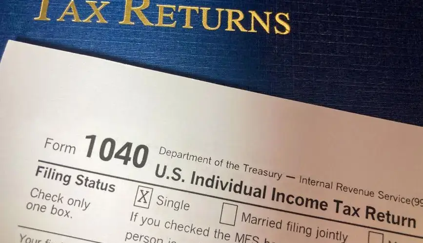 Close-up image of Form 1040 for U.S. tax returns, highlighting filing status options.
