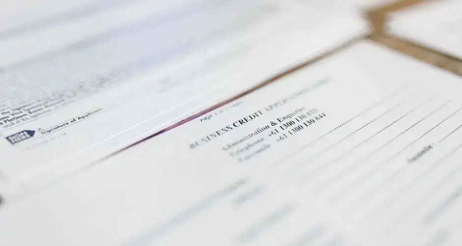 Focused image of business credit application papers, ideal for finance themes.