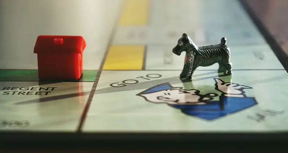 Detailed view of a Monopoly board with tokens on Regent Street.