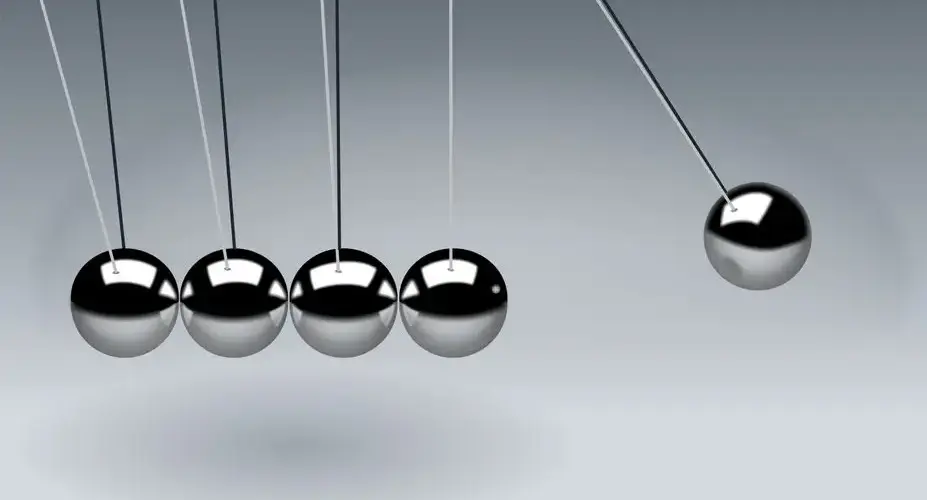 Dynamic illustration of Newton's Cradle showing motion and reflection concepts in physics.