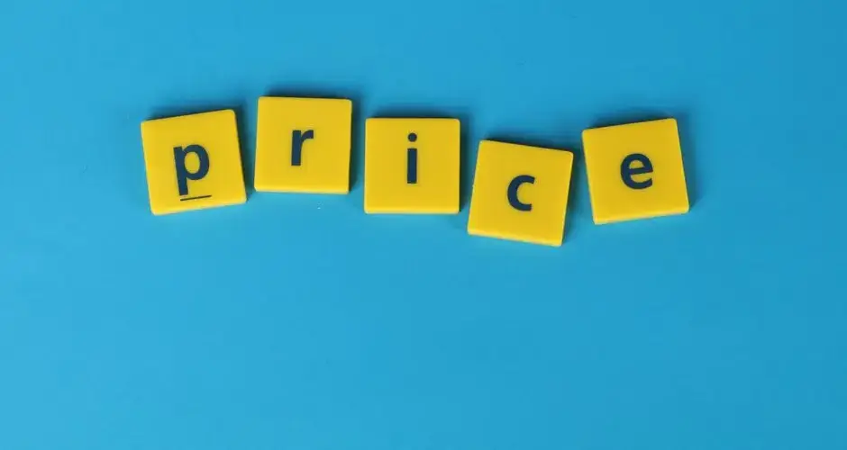 Yellow letter tiles spell the word 'price' against a vibrant blue backdrop, ideal for business concepts.