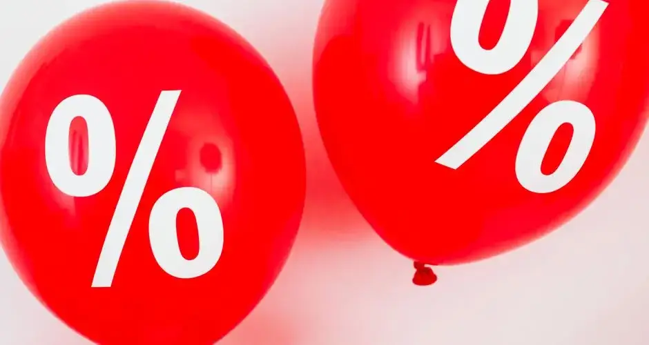 Red balloons featuring percentage symbols, ideal for sales and promotions.