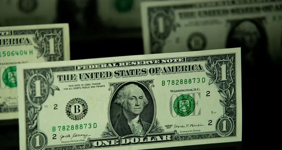 Detailed shot of a one dollar bill highlighting currency and finance themes.
