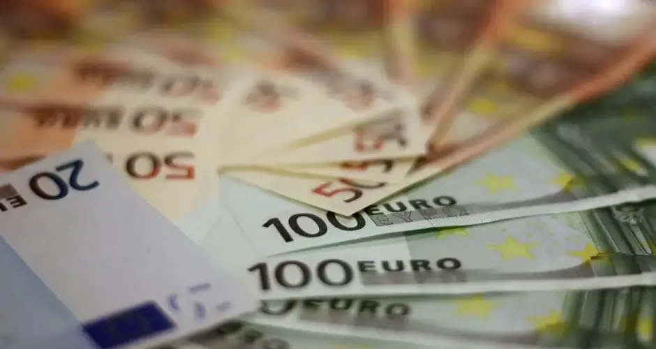 Close-up of various euro banknotes fanned out, symbolizing wealth and financial success.