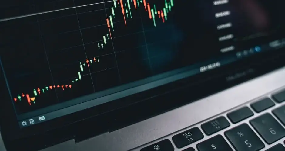 Close-up of a computer screen displaying cryptocurrency market trends and data.