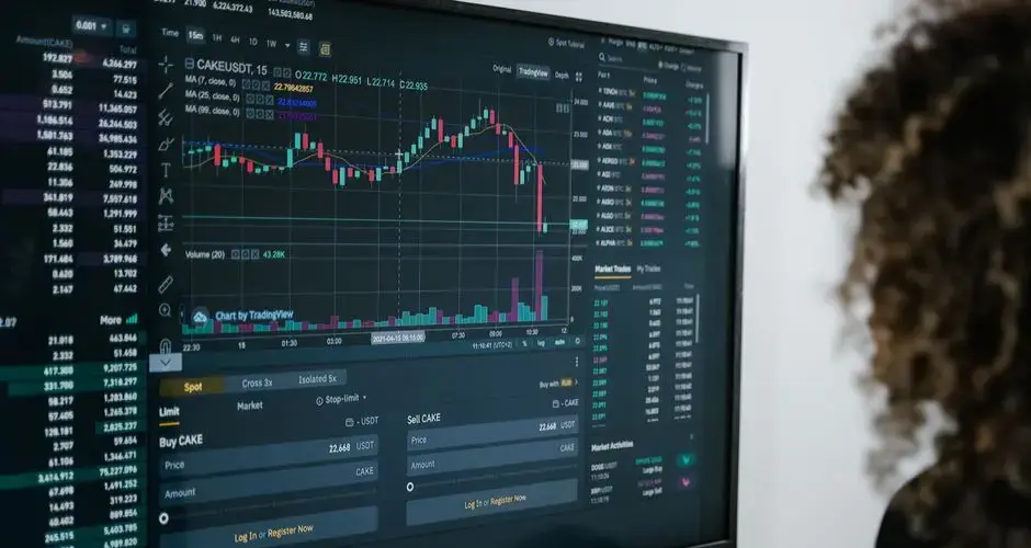 Detailed view of a financial analysis chart on a monitor with cryptocurrency trading data.