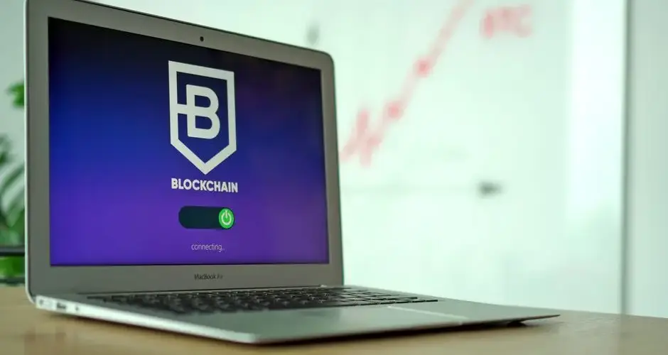 MacBook Air showing a blockchain application interface in an office setting.