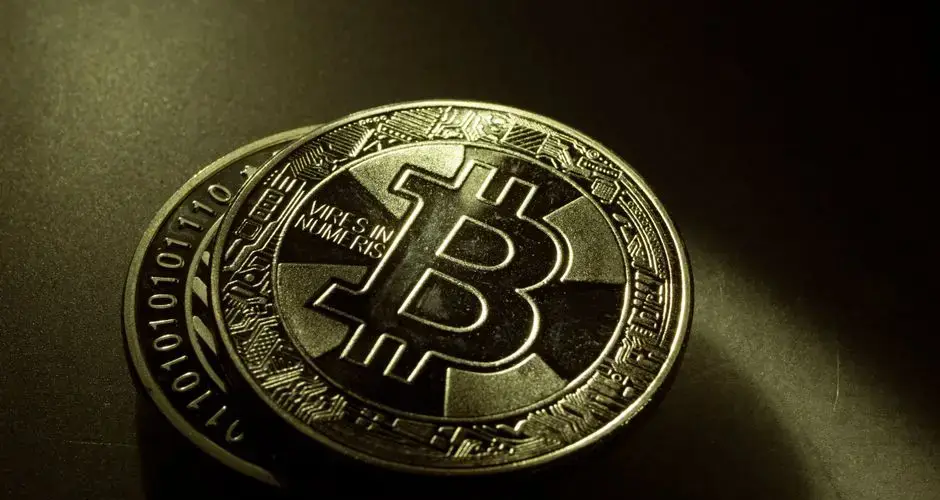 Detailed shot of a Bitcoin coin with a digital texture highlighting its cryptocurrency design.