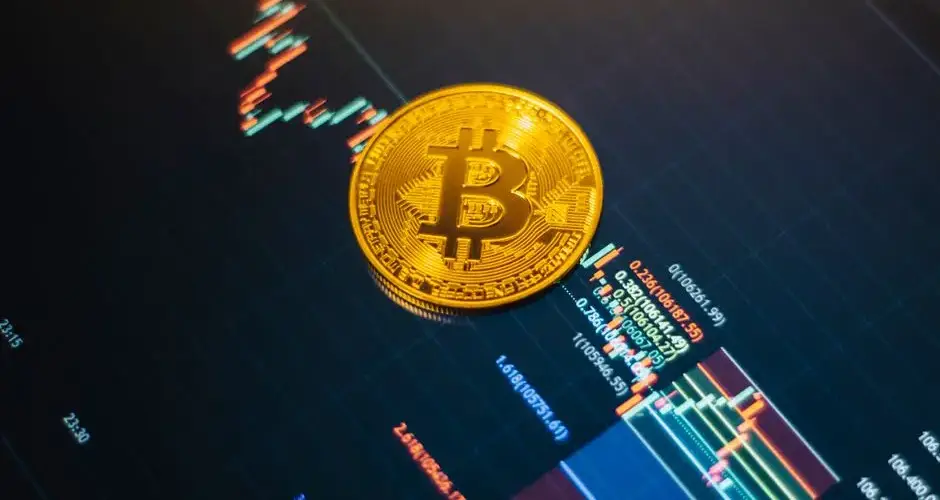 Golden Bitcoin on a rising digital financial market chart, symbolizing cryptocurrency trends.