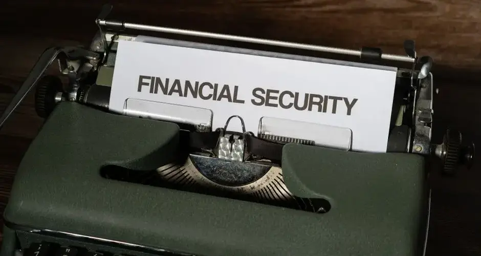 A vintage typewriter displaying a paper with the words 'Financial Security'.
