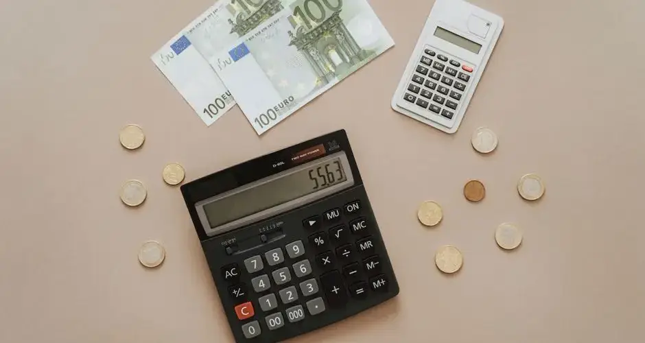 Flat lay of calculators and Euro currency, depicting financial calculations and budget management.