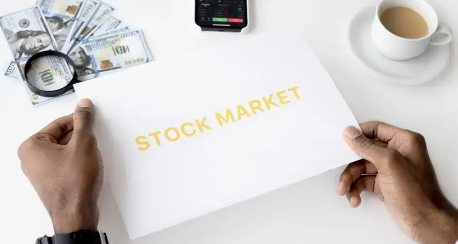 Business theme with stock market document, currency, and mobile display.
