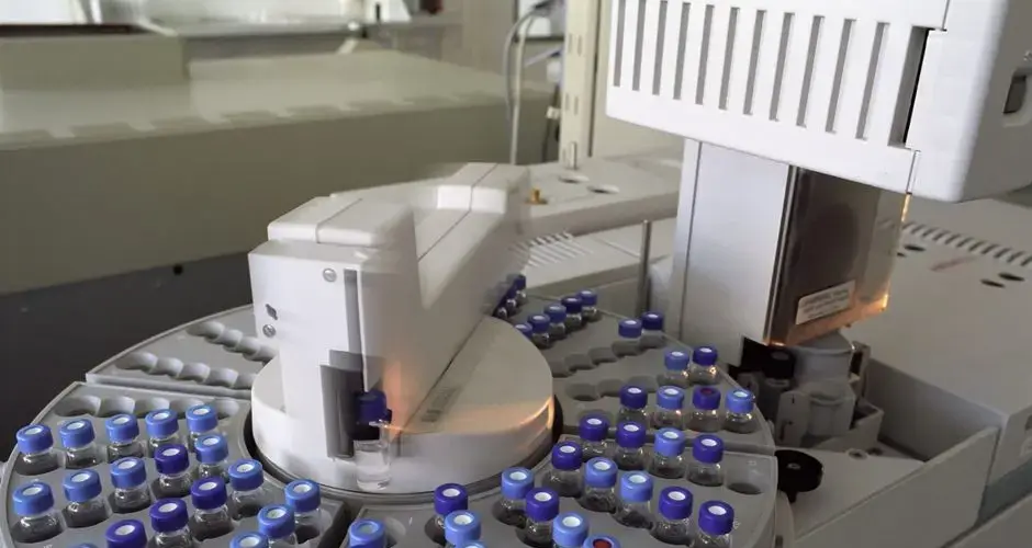 High-tech laboratory equipment with multiple vials in a scientific research facility.