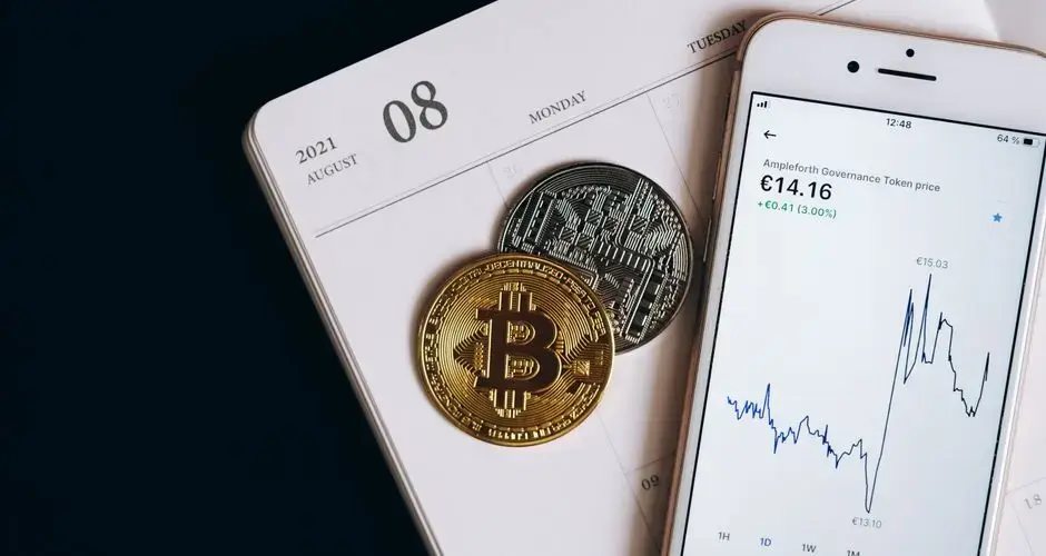 A smartphone displays cryptocurrency data alongside Bitcoin and Ethereum coins on an August calendar.
