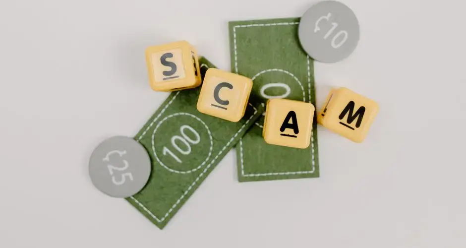 Yellow dice spelling 'Scam' on fake currency, representing financial deception.