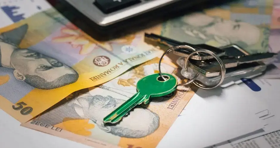 Close-up of Romanian banknotes with a set of keys, representing real estate investment and financial planning.