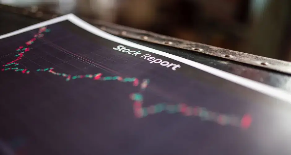 Detailed stock report showing market trends on paper charts.