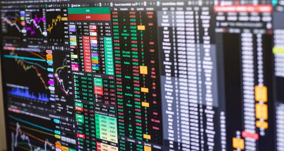 Detailed financial trading screen with colorful charts and data representing market fluctuations.