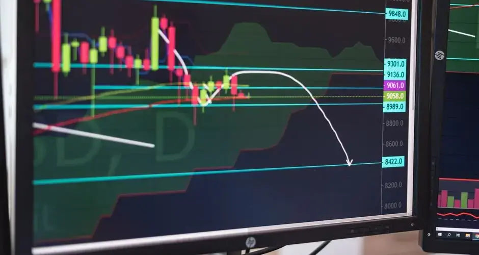 Close-up of a cryptocurrency trading chart displayed on a monitor, showing market trends and analysis.