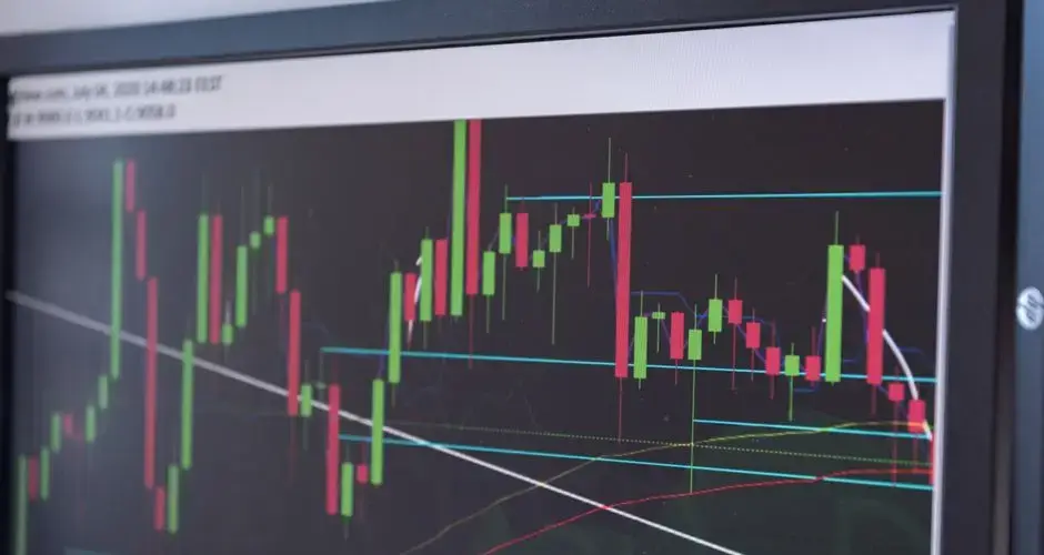 A close-up view of a cryptocurrency trading chart displayed on a monitor, showcasing market trends.