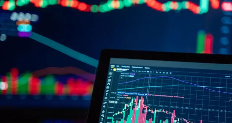 Colorful trading charts showing cryptocurrency market trends on a computer screen.
