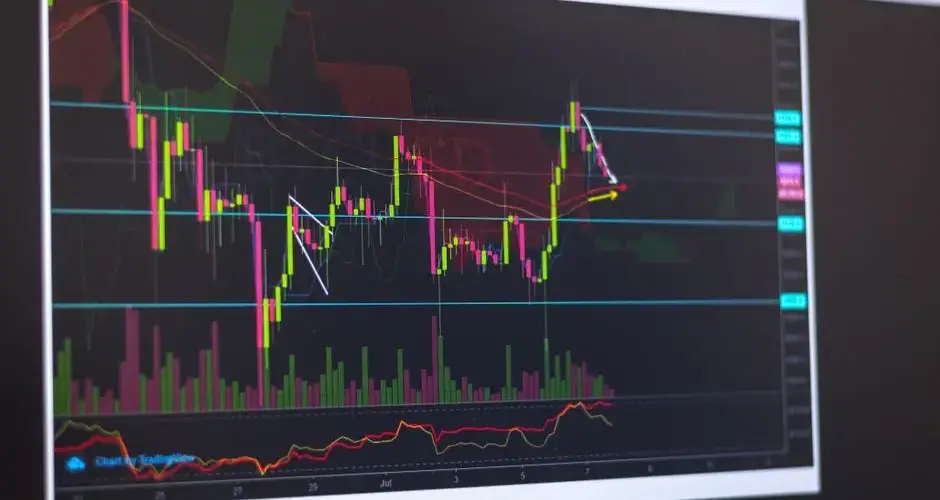 Close-up of a computer screen displaying cryptocurrency market trends and trading data.