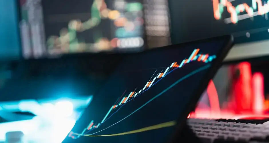 Tablet displaying cryptocurrency growth chart in a digital workspace.