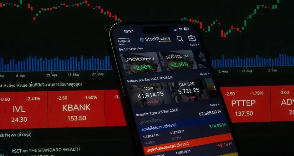 Close-up of a digital stock trading app interface with investment charts and market trends displayed.