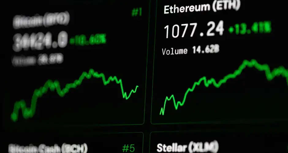 Close-up of cryptocurrency market data with Ethereum and Bitcoin prices on screen.